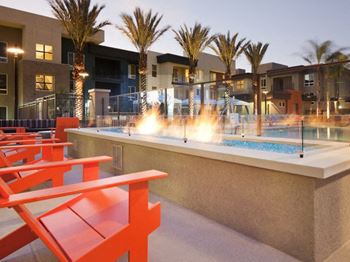 Fireplace lounge at Pulse Millenia Apartments in Chula Vista, CA